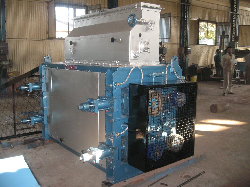 Seed cracker downstream of breaker rolls — breaker rolls handle the preliminary size reduction before this stage